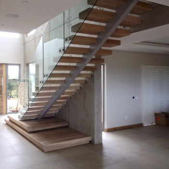 Centre spine Oak staircase with Panga Panga inlays