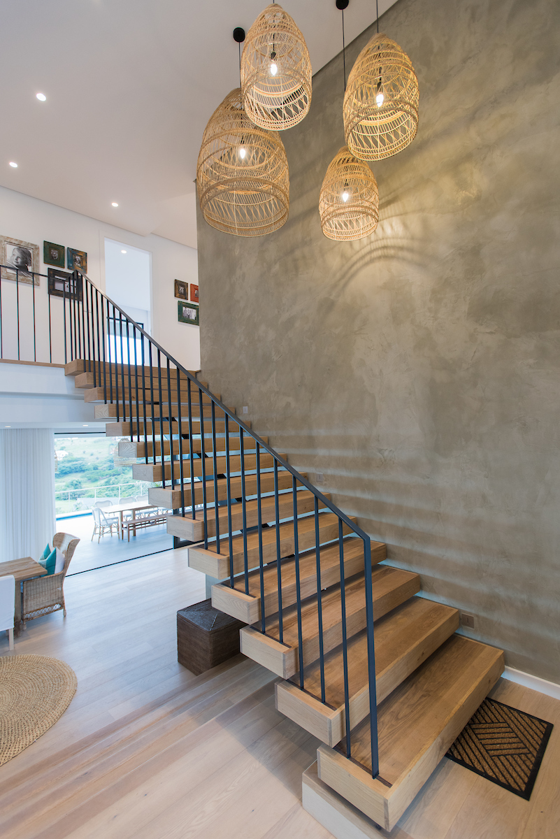 Centre spine Oak staircase with Panga Panga inlays