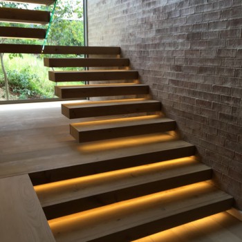 Floating Oak staircase with Panga Panga inlays