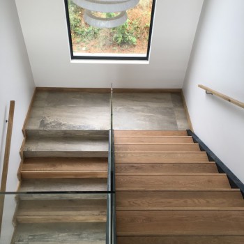 Oak tread boxes with Panga Panga inlays in steel stringers