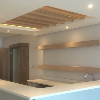 Oak floating shelf and ceiling fins